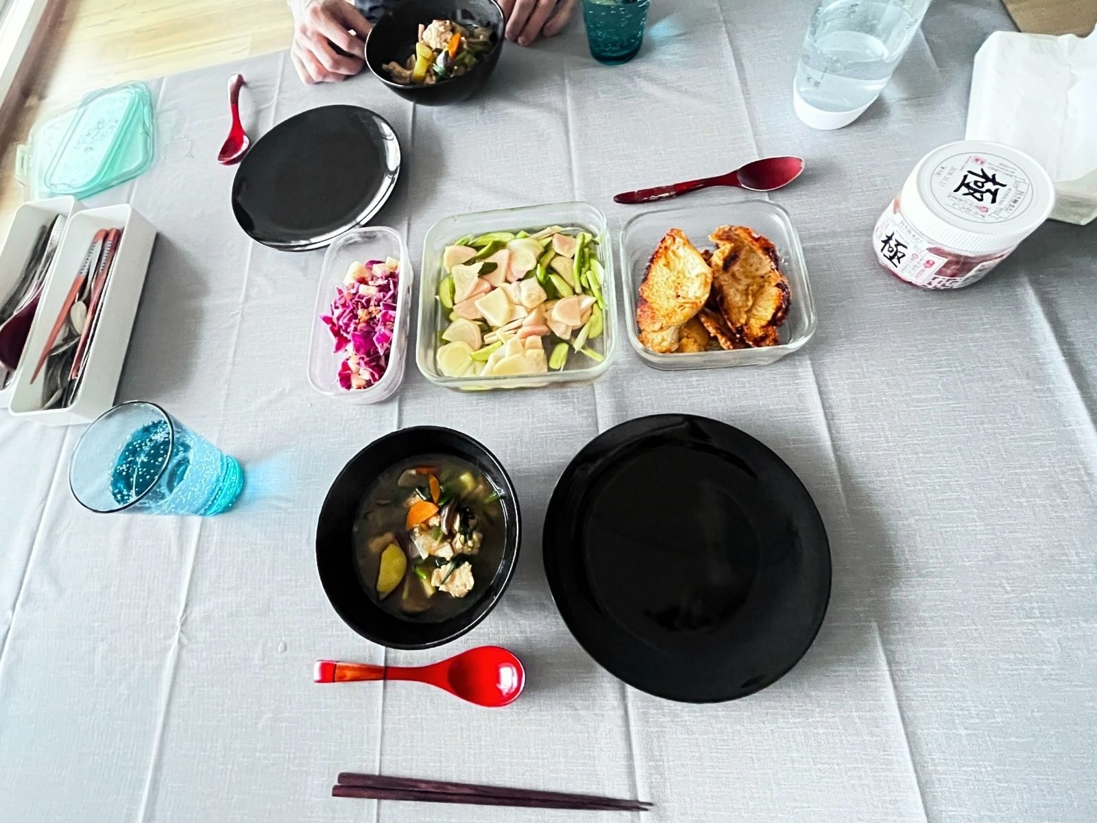 A Japanese table set for lunch, with side dishes served straight from iwaki glass containers