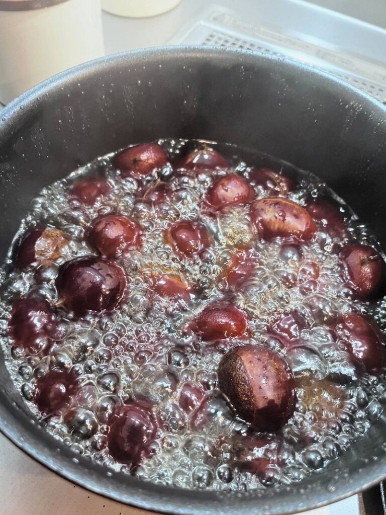 Chestnuts boiling in a pot on the stove