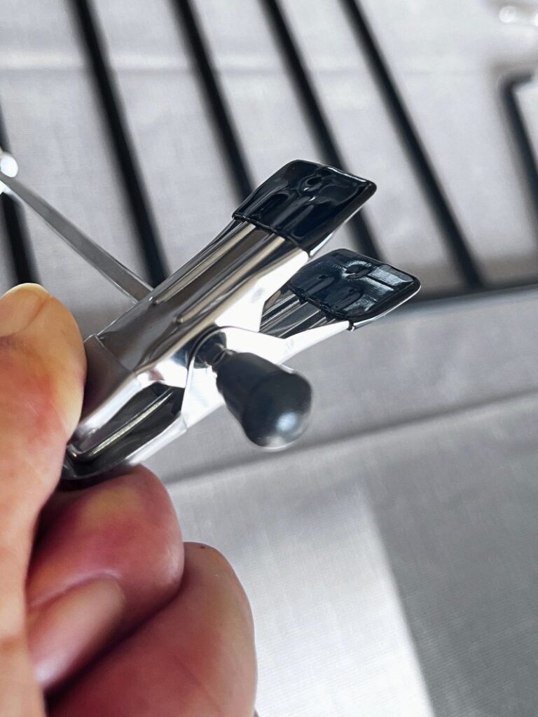 Close-up of a pants hanger clip with flat inner pads
