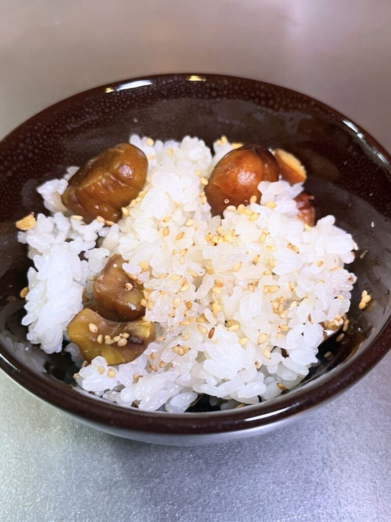 A bowl of chestnut rice topped with toasted sesame seeds