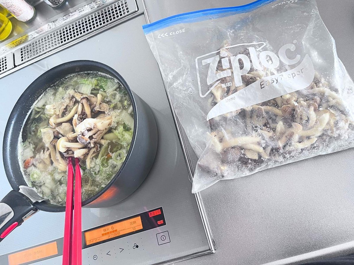 Frozen mixed mushrooms in a zipper bag next to a pan on the stove