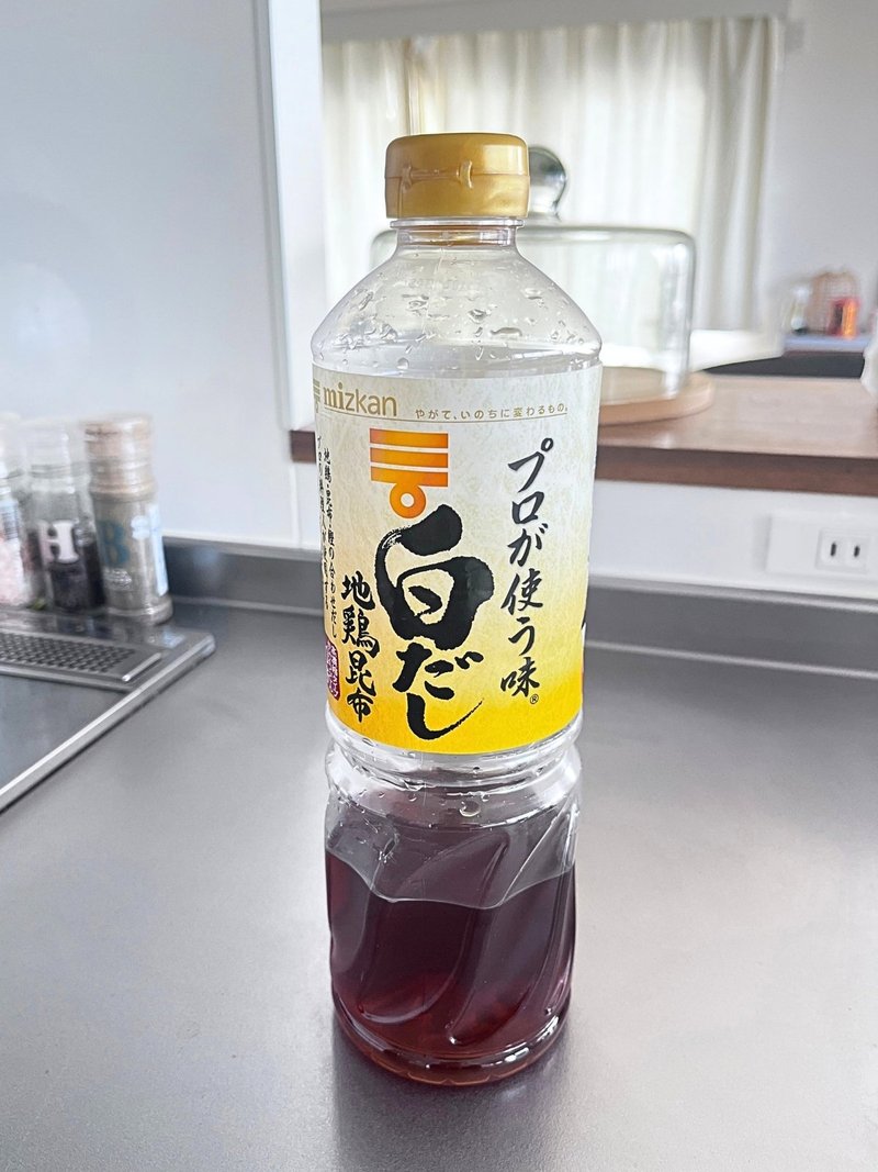A bottle of Mizkan shiro dashi on a kitchen counter